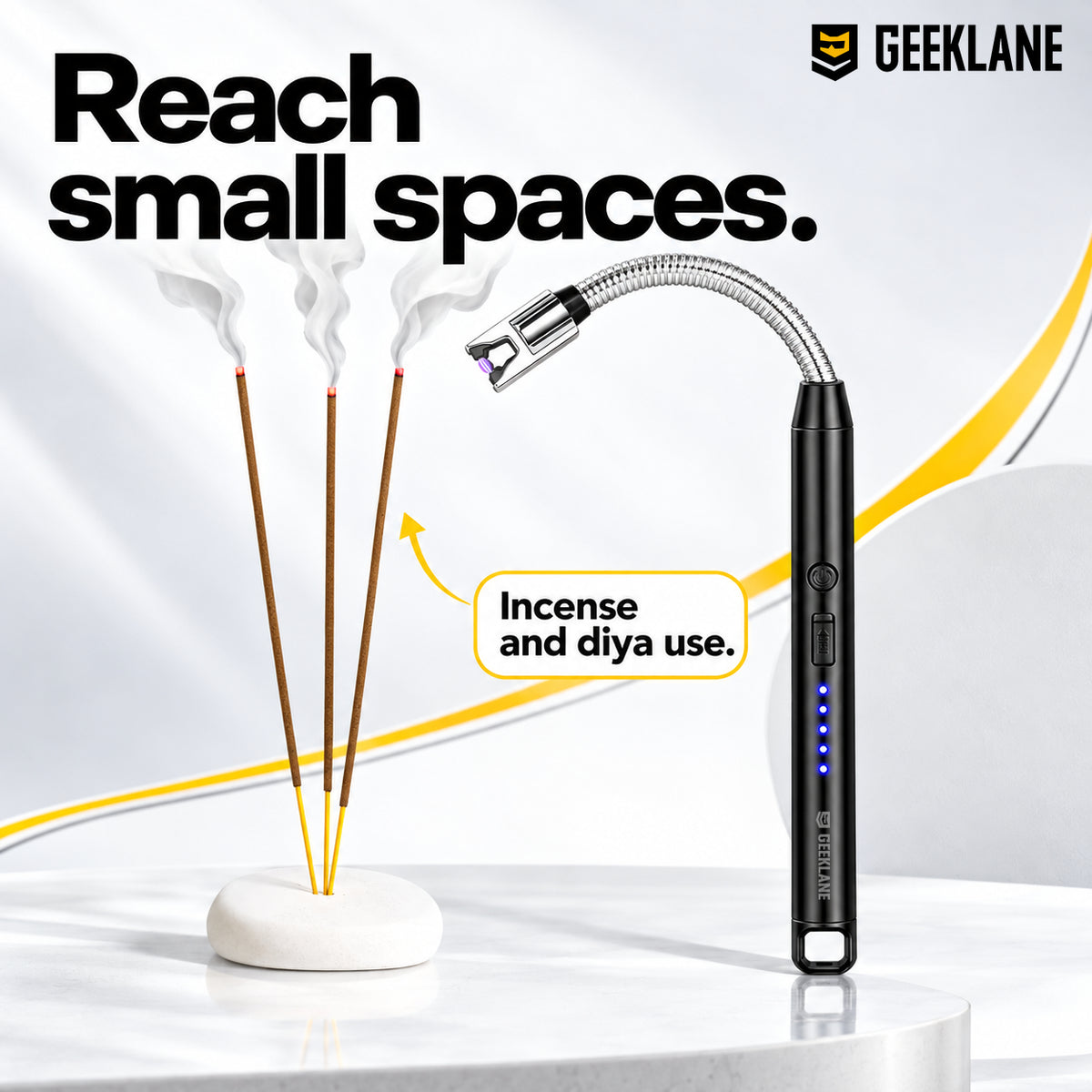 Sparq beside three incense sticks, showing its curved neck, controls and indicators.